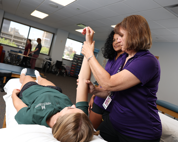 PTA Program Chair Sue Bravard Demonstrating Exercises to Students